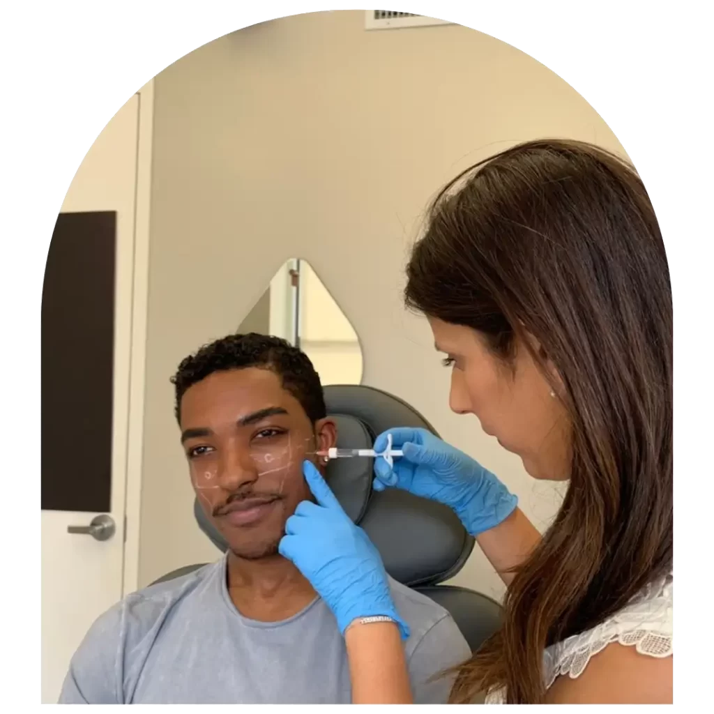 An Image showing Dr. Sonali Lal performing botox on patient's face to eliminate fine lines at Upper West Side location