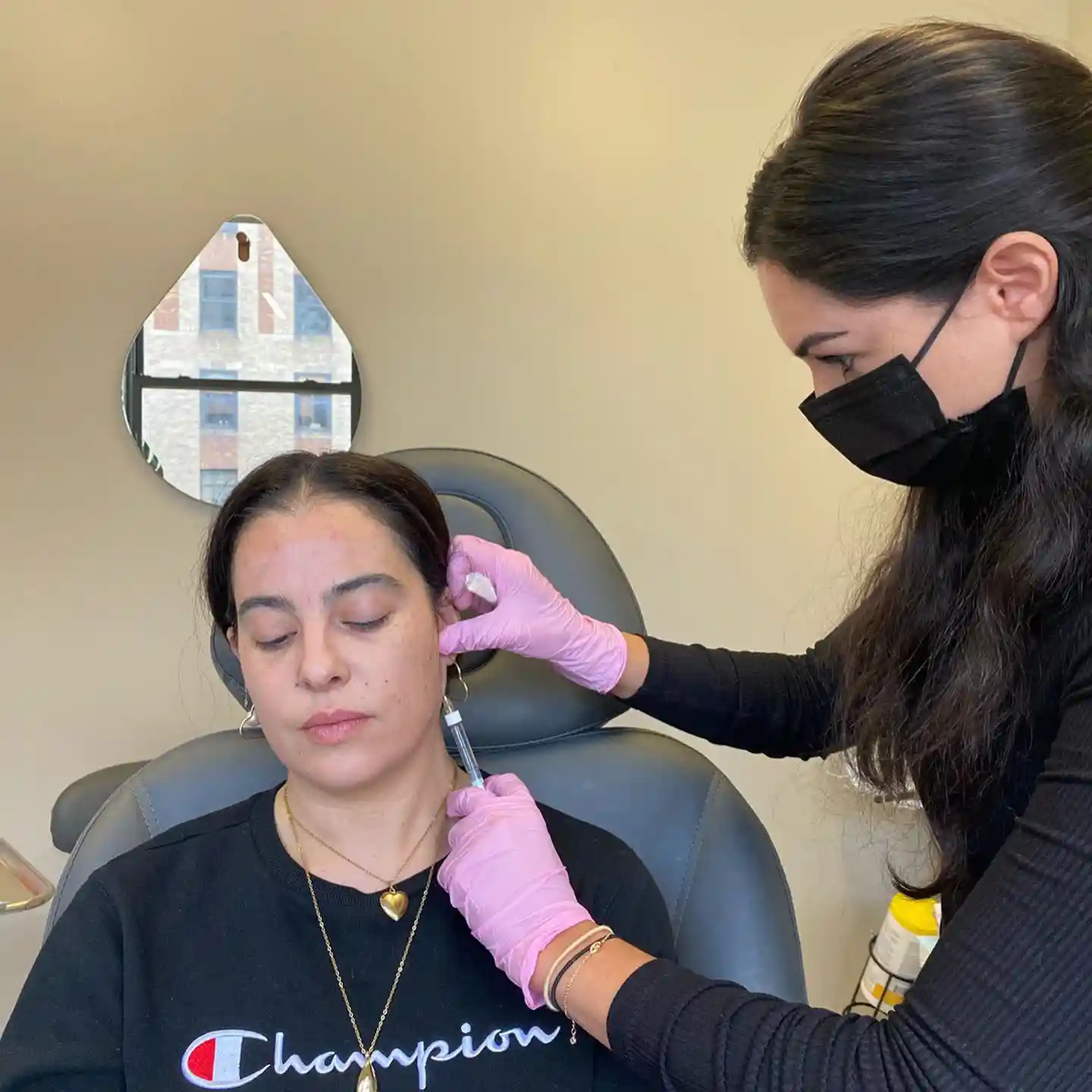 A women getting Botox injection on Masseter muscle